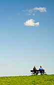 Two Women Sitting On A Bench On Parliament Hill,Hampstead,England