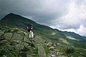 Hiker gazes towards Ben Nevis in Scotland,Ben Nevis,Scotland