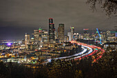 Nighttime view of the Seattle Skyline with traffic on I-5 and the Seattle Great Wheel to the far left,Seattle,Washington,United States of America