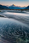 Slow shutter speed captures the motion of the Tasman River coming off the Tasman Glacier,South Island,New Zealand