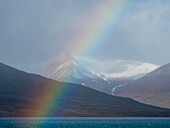 Rainbow appears off the coast of Spitsbergen,Spitsbergen,Svalbard,Norway
