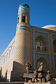 Sculpture beside the Kalta-Minor tower in Itchan Kala,Khiva,Uzbekistan