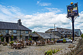 Guests enjoying the outside restaurant patio at Smugglers Bar and Hotel,Jamaica Inn,Bodmin Moor,Launceston,Cornwall,England