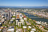 Cityscape of Portland,Oregon with bridges crossing the Willamette River and a view of Mount Saint Helens,Mount Tabor and the Cascade Range in the distance,Portland,Oregon,United States of America