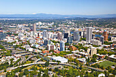 Cityscape of Portland,Oregon with the Willamette River and a view of Mount Tabor and the Cascade Range in the distance,Portland,Oregon,United States of America