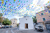 Village church with flags in Orgosolo Village,Italy,Orgosolo,Nuoro Sardinia,Italy