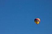 A hot air balloon flying in a clear,blue sky.,Winters,California