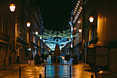 City walkway in a shopping district at night in Lisbon,Lisbon,Portugal