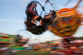 In Rainier,Oregon,a traveling carnival operates and young people enjoy the ride,Rainier,Oregon,United States of America