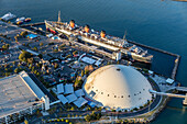 RMS Queen Mary,now a hotel ship and tourist attraction at Long Beach,California.  Dome is former home of Howard Hughes' Spruce Goose,Long Beach,California,United States of America
