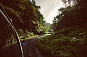 Driving across the island of Dominica in the Caribbean,the main highway leading from the airport heading into the capital city of Roseau,Dominica,West Indies
