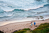 High angle view of surfers on the beach at the water's edge,Bathsheba,Barbados