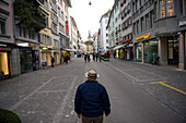 Senior man stands in the middle of a city street in Zurich,Switzerland,Zurich,Switzerland