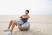 Man Doing Sit-Ups at Beach