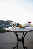 Table with Flowers,Fruit and Wine on Patio