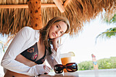 Portrait of Woman in Tiki Hut,Florida,USA