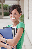 Portrait of University Student Holding Books