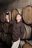 Winemaker Examining a Glass of Wine