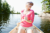 Woman Canoeing on Kahshe Lake,Muskoka,Ontario,Canada