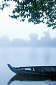 Canoe in Morning Mist at Sras Srang,Angkor,Cambodia