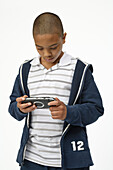 Boy Playing Handheld Video Game