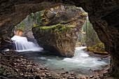 Waterfall and cave in Johnston Canyon,Banff National Park,Alberta,Canada
