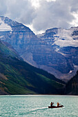 Canoeists on Lake Louise with Mounts Lefroy and Victoria,Banff National Park,Alberta,Canada