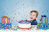 Young Boy with Birthday Cake and Presents