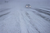 Car on Road in Snow Storm,Ottawa,Ontario,Canada