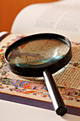 Magnifying Glass on Page of Book