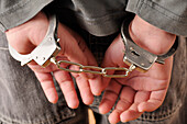 Close-up of Handcuffs on Boy's Wrists