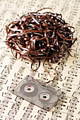 Unravelled Cassette Tape on Sheet Music