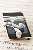 Earbuds,iPod and Sheet Music