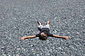 Boy Lying Down on the Ground,Corsica,France