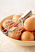 Bowl of Eggs with Whisk