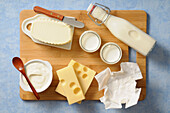 Overhead View of Variety of Dairy Products on Cutting Board