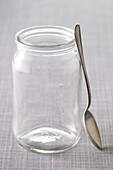 Close-up of Empty Glass Jar and Spoon
