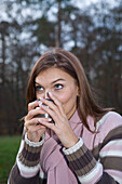 Woman Drinking a Cup of Coffee