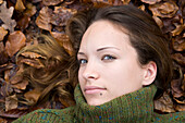 Woman Lying Down in Autumn Leaves,Mannheim,Baden-Wurttemberg,Germany