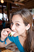 Woman Eating Taco,Mexico