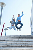 Couple Jumping in Air
