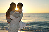 Couple at Beach at Sunset,Reef Playacar Resort and Spa,Playa del Carmen,Mexico