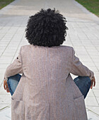 Back of Young Man Sitting Outdoors,Mannheim,Baden-Wurttemberg,Germany