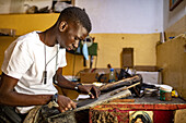 Cobbler in the craftsmen's village,Thies,Senegal,West Africa,Africa
