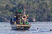 Tuna fisherman retrieving a purse-seine net,Bangka Island,off the northeastern tip of Sulawesi,Indonesia,Southeast Asia,Asia