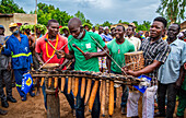 Men playing traditional instruments at a tribal festival,Southern Chad,Africa