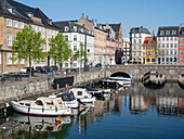 Canal under the Strombroen (Storm Bridge) with colourful houses in the old town,Copenhagen,Denmark,Scandinavia,Europe