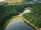 Aerial view of Lagoa Empadadas,Lagoa do Eguas and Lagoa Rasa lakes with low clouds and pine trees forest,Sao Miguel island,Azores islands,Portugal,Atlantic,Europe