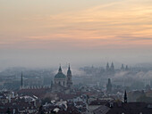 View of Prague spires and towers in morning mist from Petrin Hill,Prague,Czechia (Czech Republic),Europe