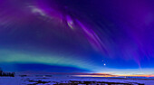 The aurora of March 23,2023,caught early in the evening when there was a green arc to the south as the sky darkened that exhibited a "dunes" type of structure,with horizontal banding rather than vertical rays or curtains. Above is a purple arct that has some characteristics of a STEVE arc but is likely a standard vertical curtain. At right are Venus and the crescent Moon below,above the glow of twilight. Orion is left of centre,with Sirius embedded in the dunes arc. This is looking southwest to west. The time was about 9 pm MDT.